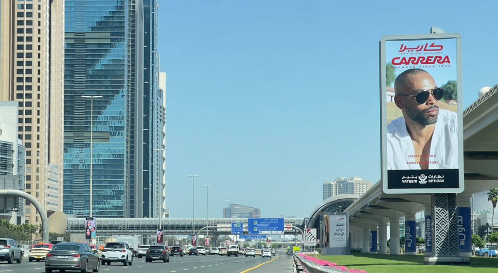 Outdoor campaign strategy leveraging large roadside billboards for mass audience reach across UAE highways