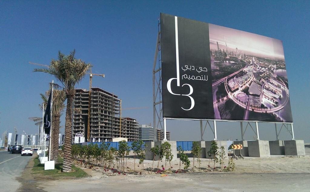 Outdoor campaign strategy featuring roadside billboard placement near real estate developments in the UAE