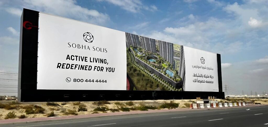 Abu Dhabi DOOH Advertising featuring a large-format real estate digital billboard along a major roadway