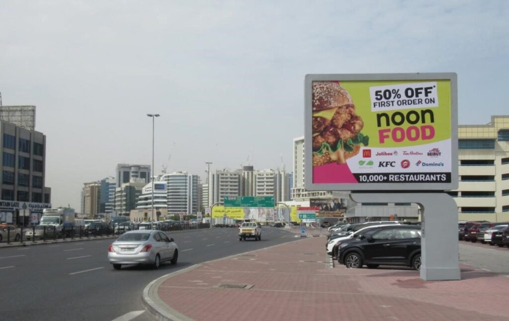 Abu Dhabi DOOH Advertising promoting a food delivery brand through a roadside digital display