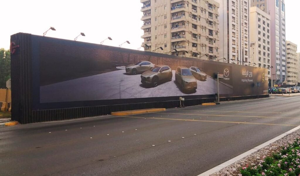 Outdoor Billboard Advertising UAE displayed on a large roadside hoarding along a premium urban corridor