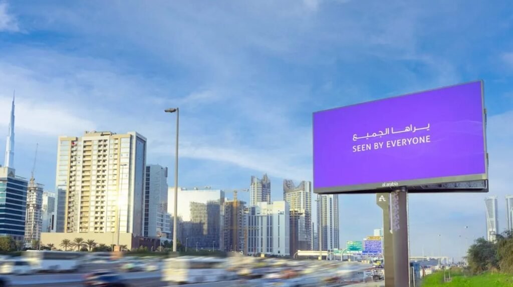 Digital outdoor screen displaying brand messaging in a high-traffic area, representing OOH Advertising Al Ain for premium visibility.