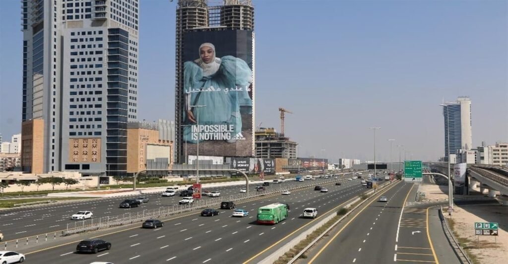 Roadside advertising hoarding promoting business messaging through Outdoor Media in RAK along a major roadway