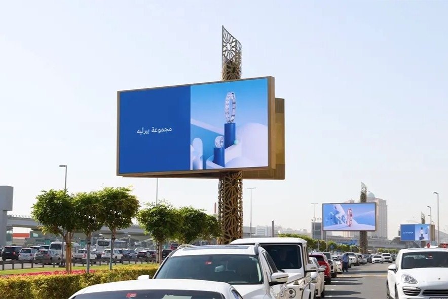 Premium outdoor digital screens along a busy Dubai roadway showcasing Dubai DOOH screens advertising for luxury brand visibility