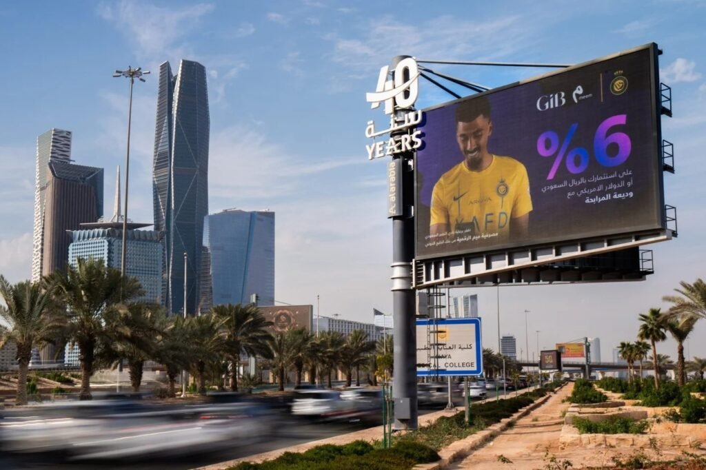 High-impact roadside digital billboard near Dubai skyline highlighting financial advertising through Dubai DOOH screens advertising