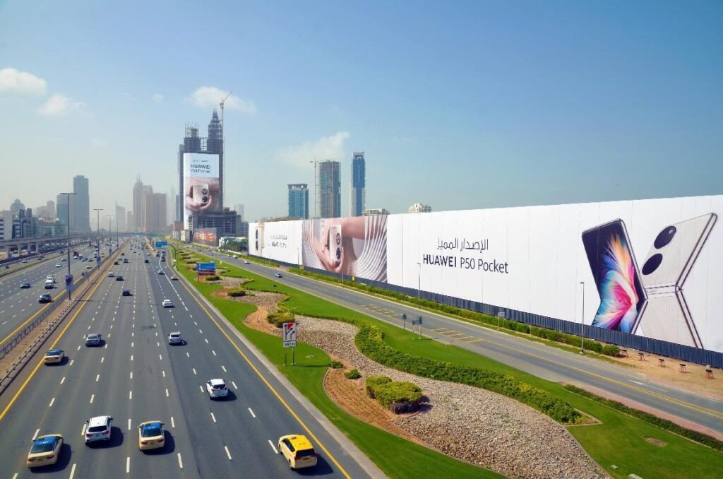 Highway mega billboard campaign in Dubai featuring smartphone advertising and illustrating billboard campaign cost Dubai scale factors