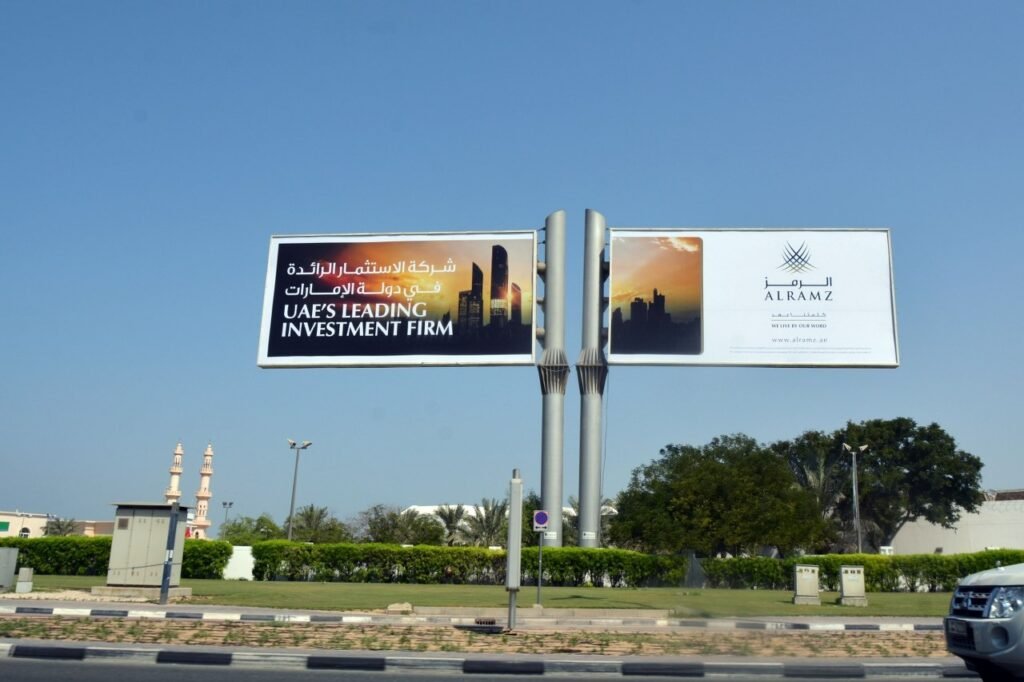 Double-sided roadside billboard in Dubai urban area reflecting strategic placement and billboard campaign cost Dubai efficiency