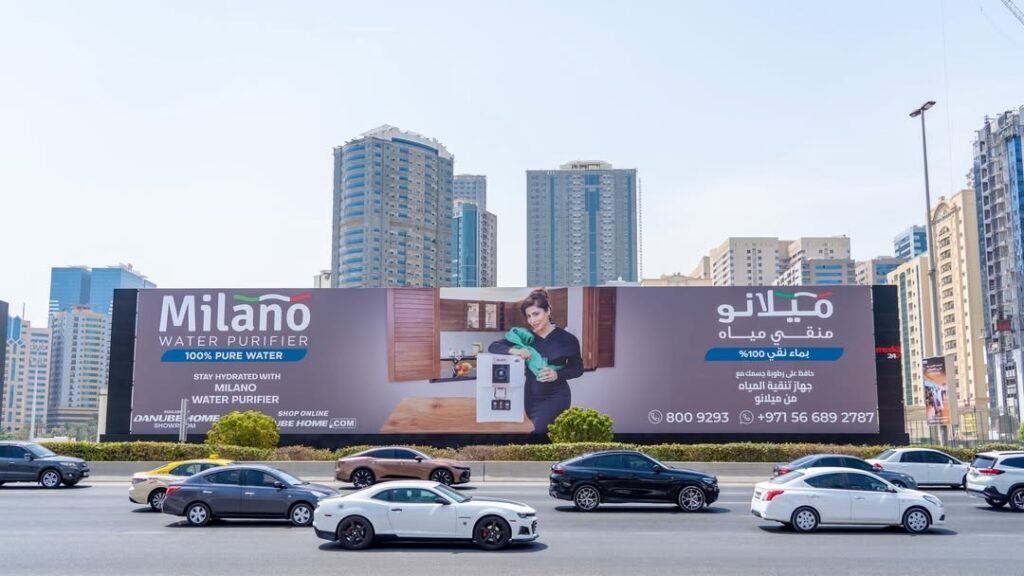 Consumer appliance brand billboard placed along a high-traffic city road, utilizing High-Impact Advertising Formats for mass audience reach.