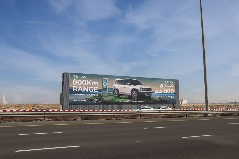 SUV range outdoor billboard along a busy expressway showcasing Outdoor Campaign ROI with sustained commuter exposure.