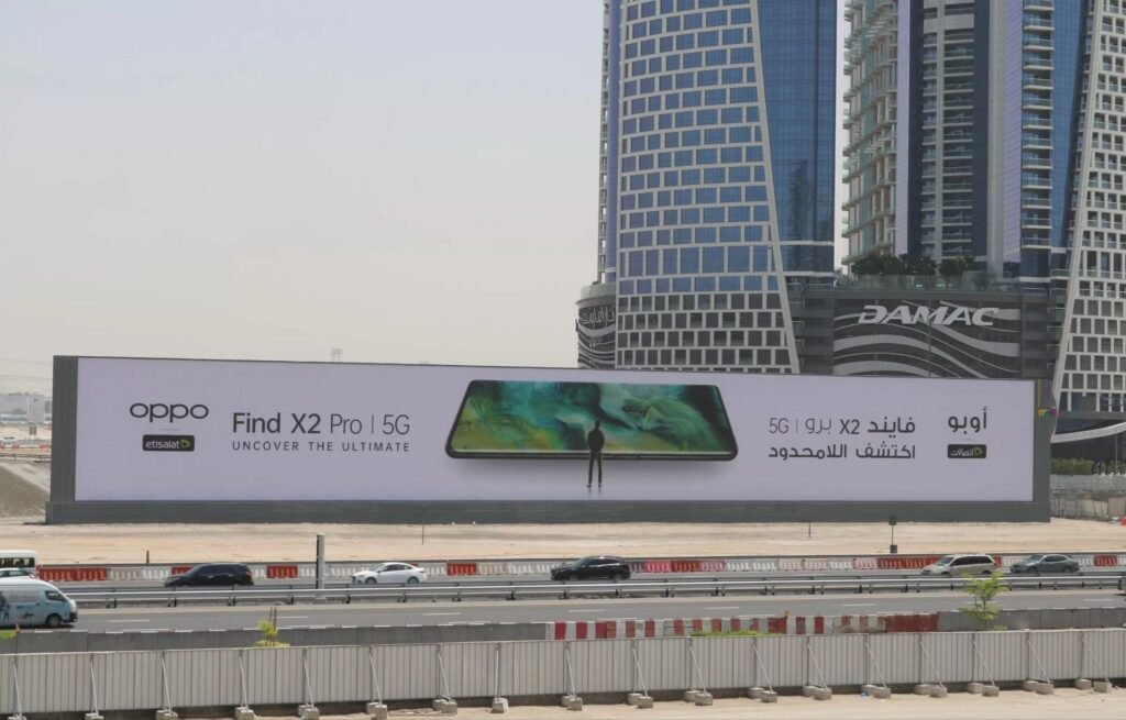 Large OPPO Find X2 Pro 5G roadside hoarding in an urban high-traffic corridor demonstrating strong Outdoor Campaign ROI through premium visibility.
